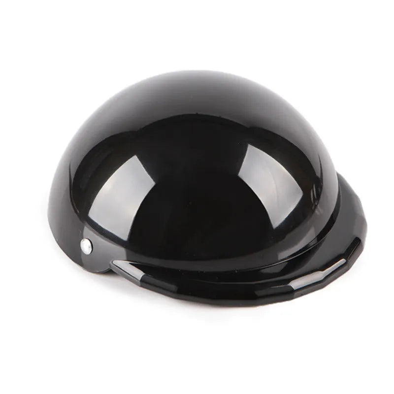 Plastic dog motorcycle cap helmet in assorted colours on a white background