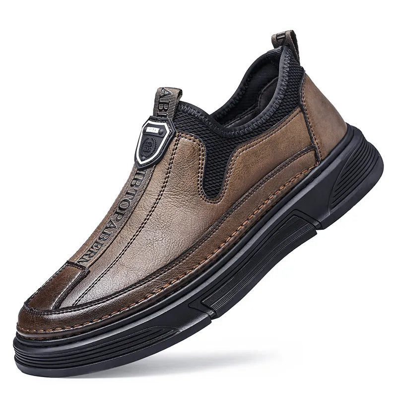 Men's black leather casual shoes with round toe design on solid colour background