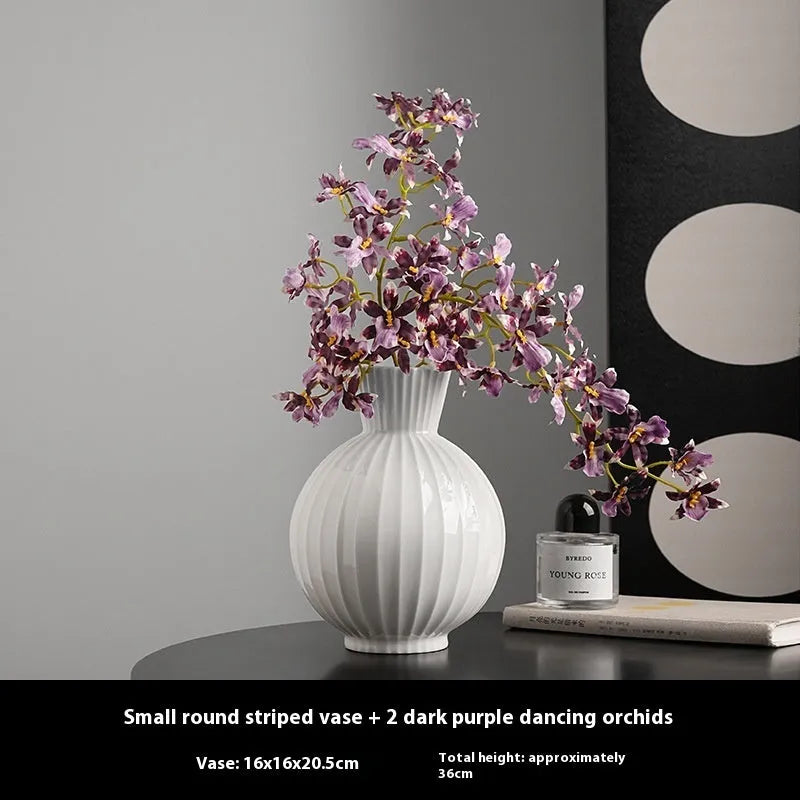White ceramic ball striped vase in American country style on table with orchid arrangement