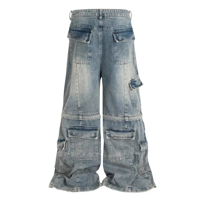 Black washed-out cotton overalls on a hanger, showing detachable pockets and a zip fly.