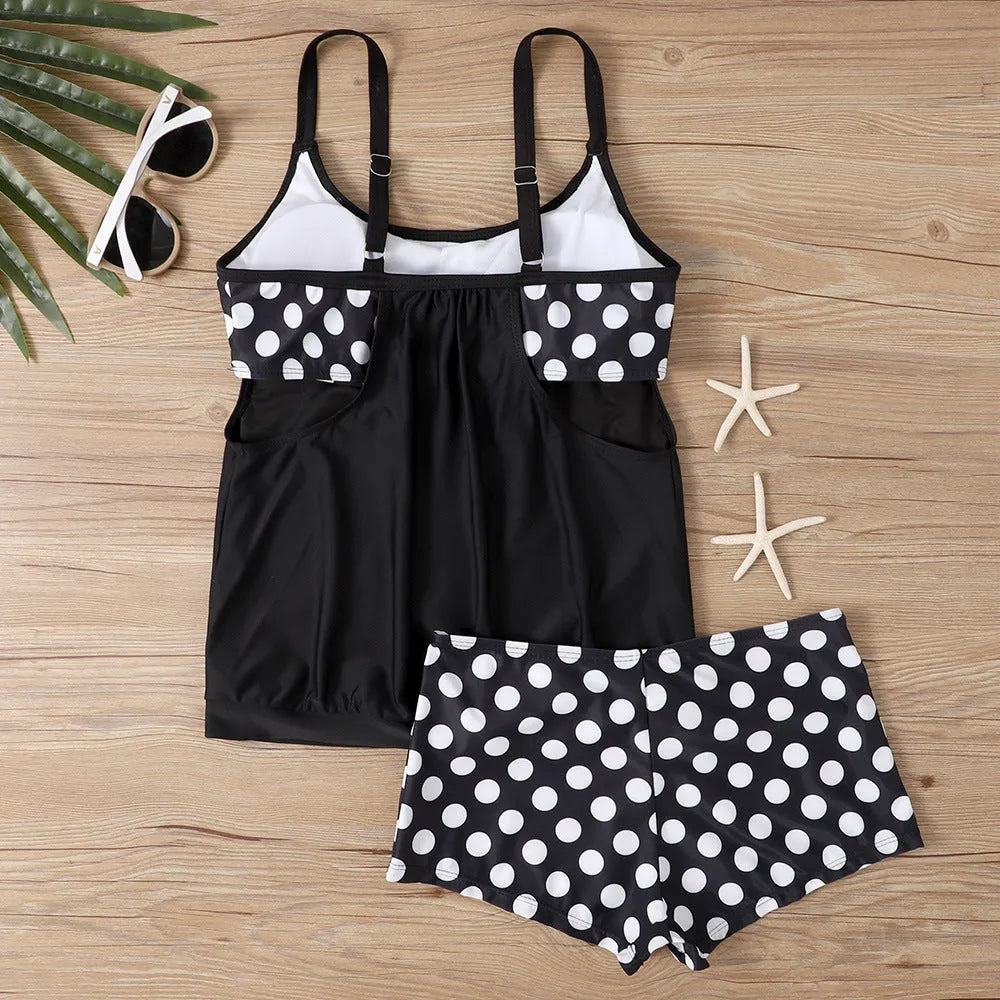 Women's black polka dot high waist swimsuit briefs on a white background.