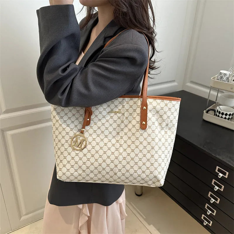 PU leather shoulder bag with sewing thread detail in black colour showing 42cm width and structured design