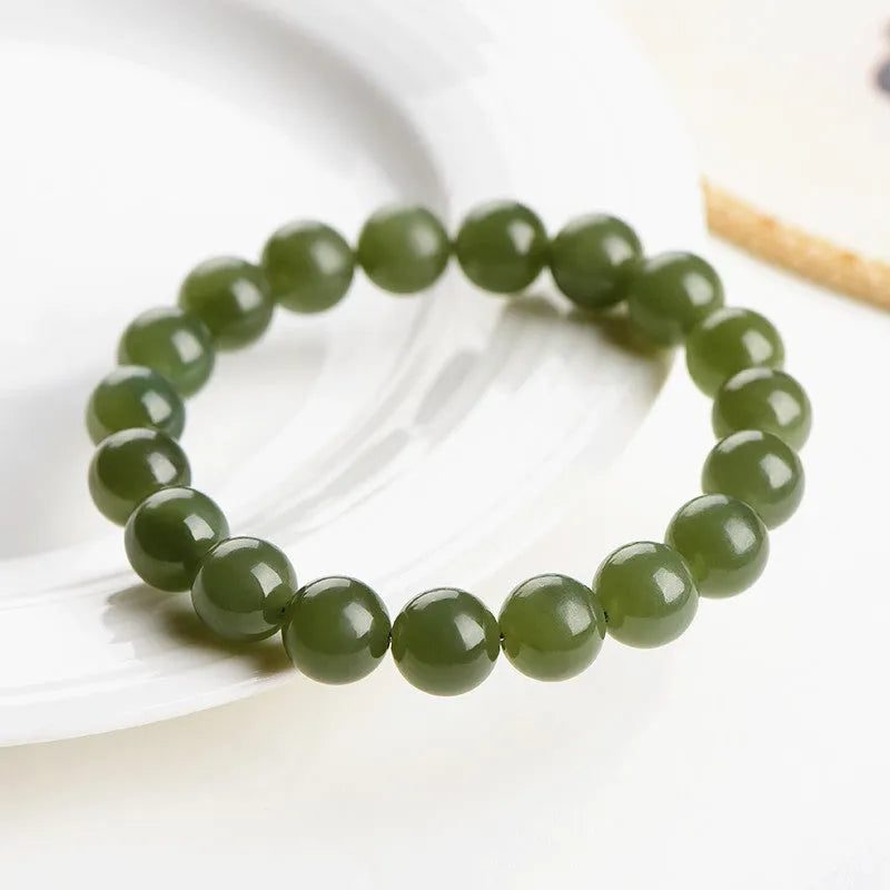 Hetian jade bead bracelet in ice-like clear colour on a white background.