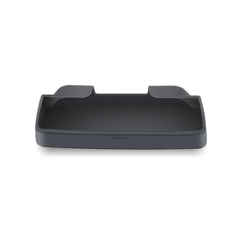 Black silicone glasses storage case accessory installed in a Tesla Model 3 or Y centre console armrest.