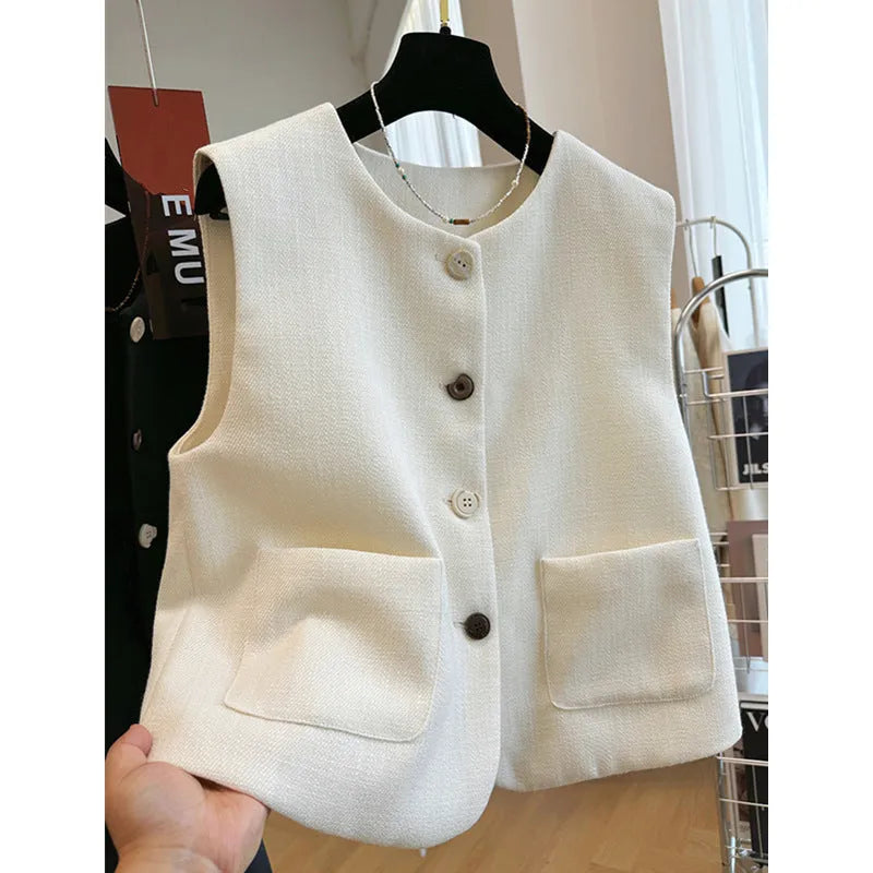 Sleeveless bandage dress vest with round neck in milky white or black polyester fabric.