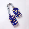 Dog wearing blue knee protector with padded elbow patch and matching scarf with dog print
