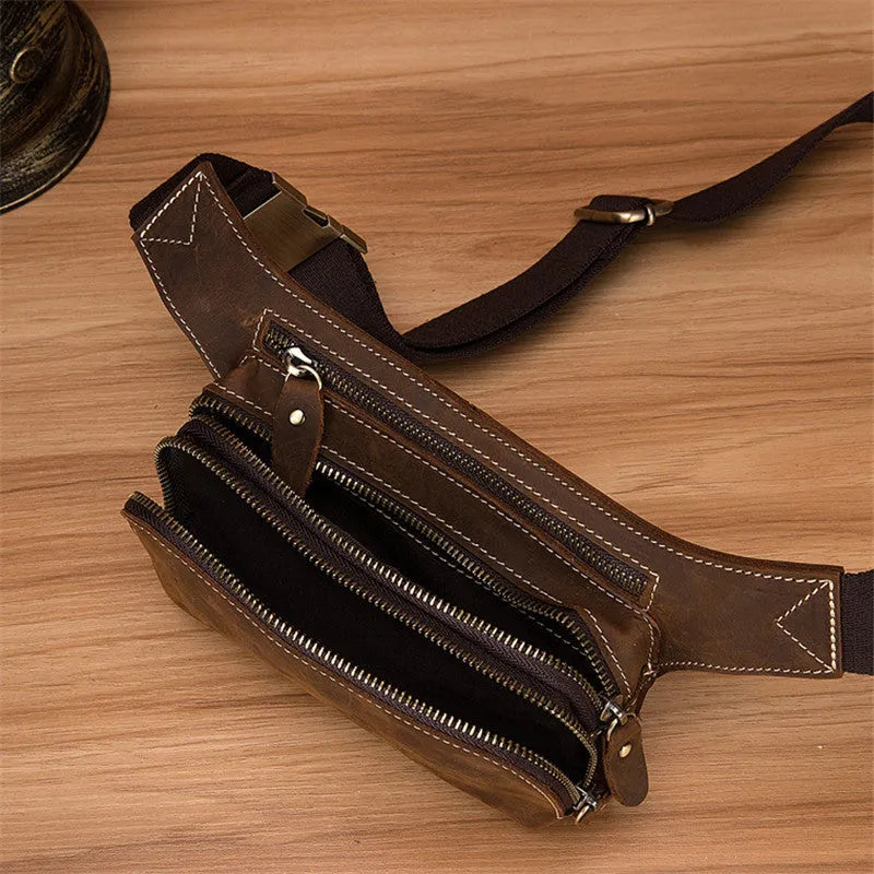 Brown cowhide leather men's sports waist bag showing pull closure and dimensions