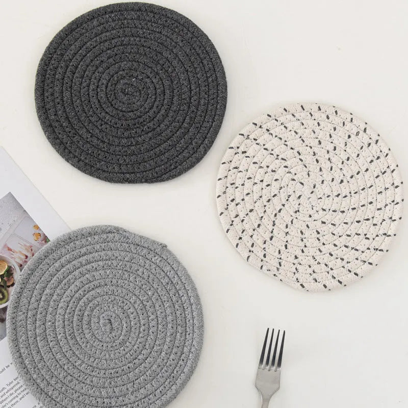 Three round 18cm cotton cord coasters in a set, shown in a blue colour option.