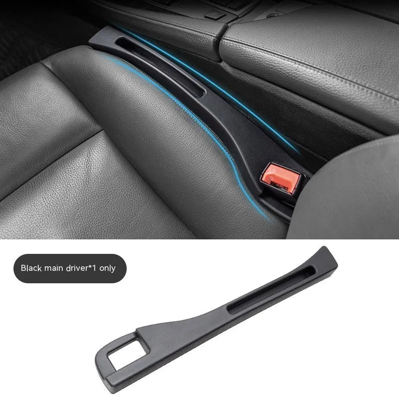 Black plastic car seat gap storage pocket with handle placed between vehicle seats.