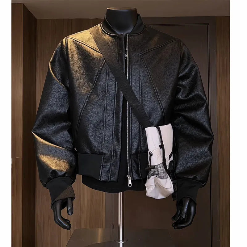 Man wearing a long black PU leather jacket with a tight, tailored fit.