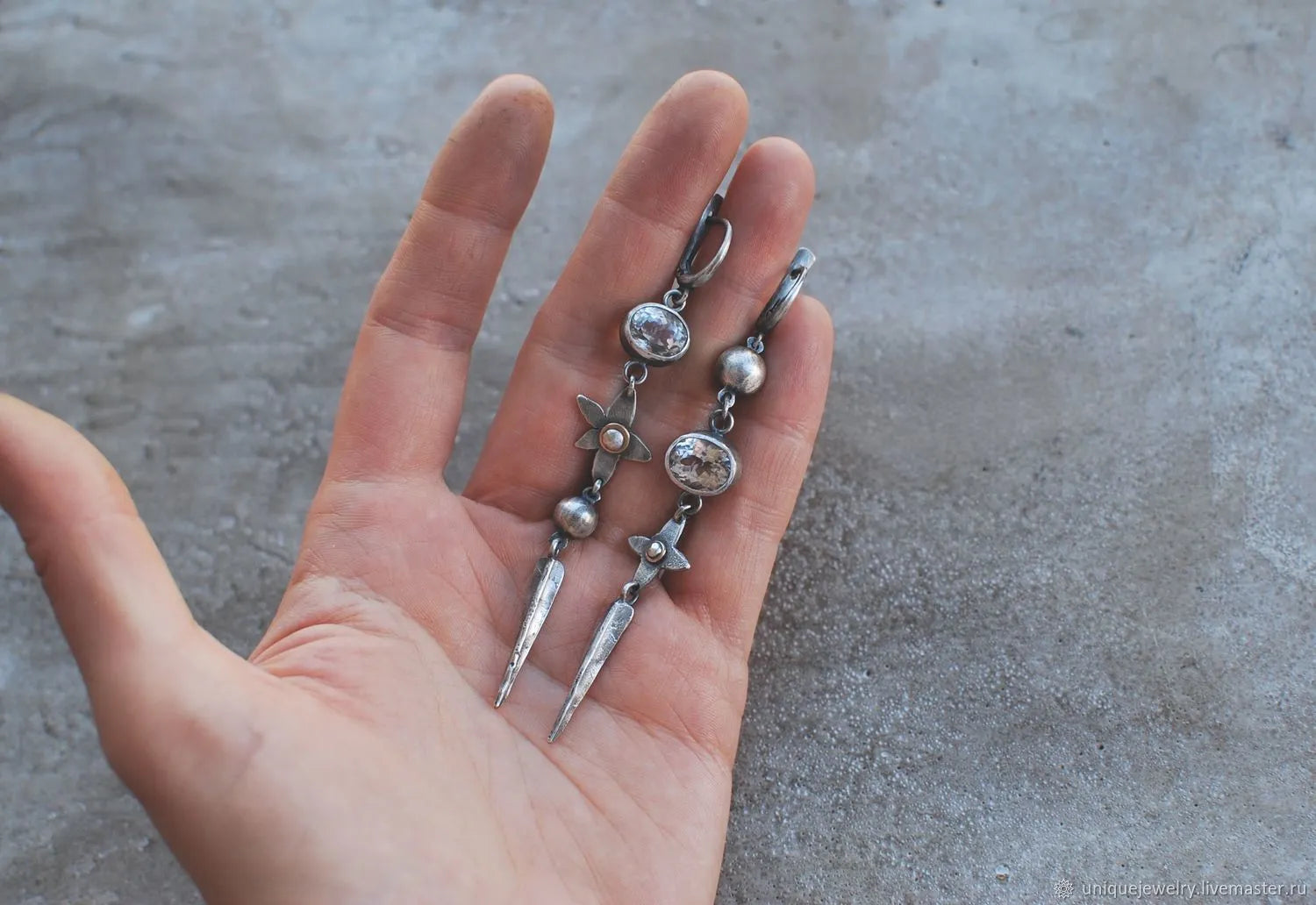 Long geometric XINGX design pendant earrings in antique silver tone with rhinestones.