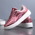 Rose gold sequin platform sneaker with a thick white MD sole and round toe.