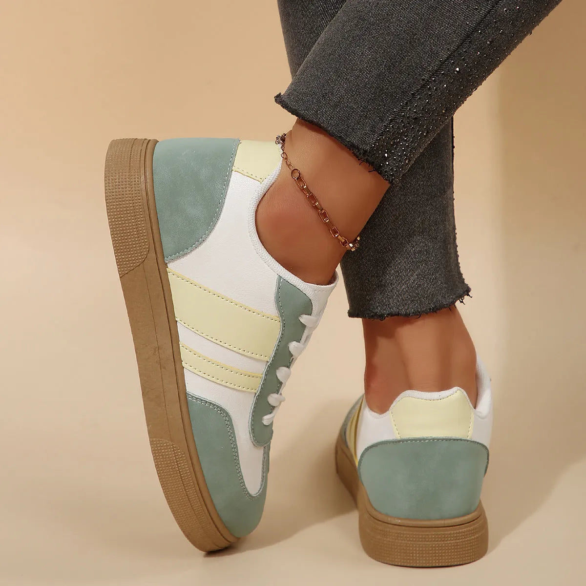 Green women's retro sports shoes with cross strap detail and round toe