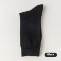 A pair of solid colour men's mid-calf socks in combed cotton, shown in a light grey shade.