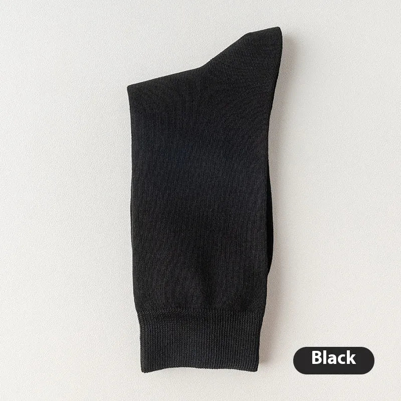 A pair of solid colour men's mid-calf socks in combed cotton, shown in a light grey shade.