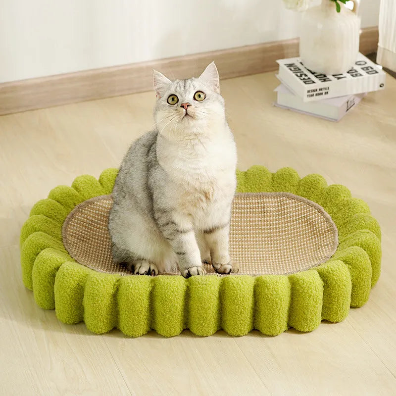 Green oval sisal cat scratching pad and lounge bed measuring 65cm long.