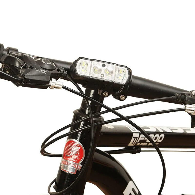 Black bicycle headlight with 350 lumen XPG-LED and rechargeable battery mounted on handlebars