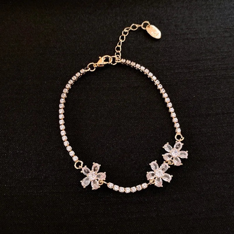 Women's gold colour copper bracelet with geometric quadrilateral design and inlaid zircon stones