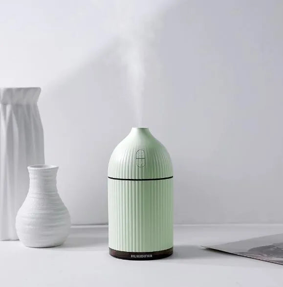 White USB-powered 300ml aromatherapy diffuser with LED light showing compact dimensions