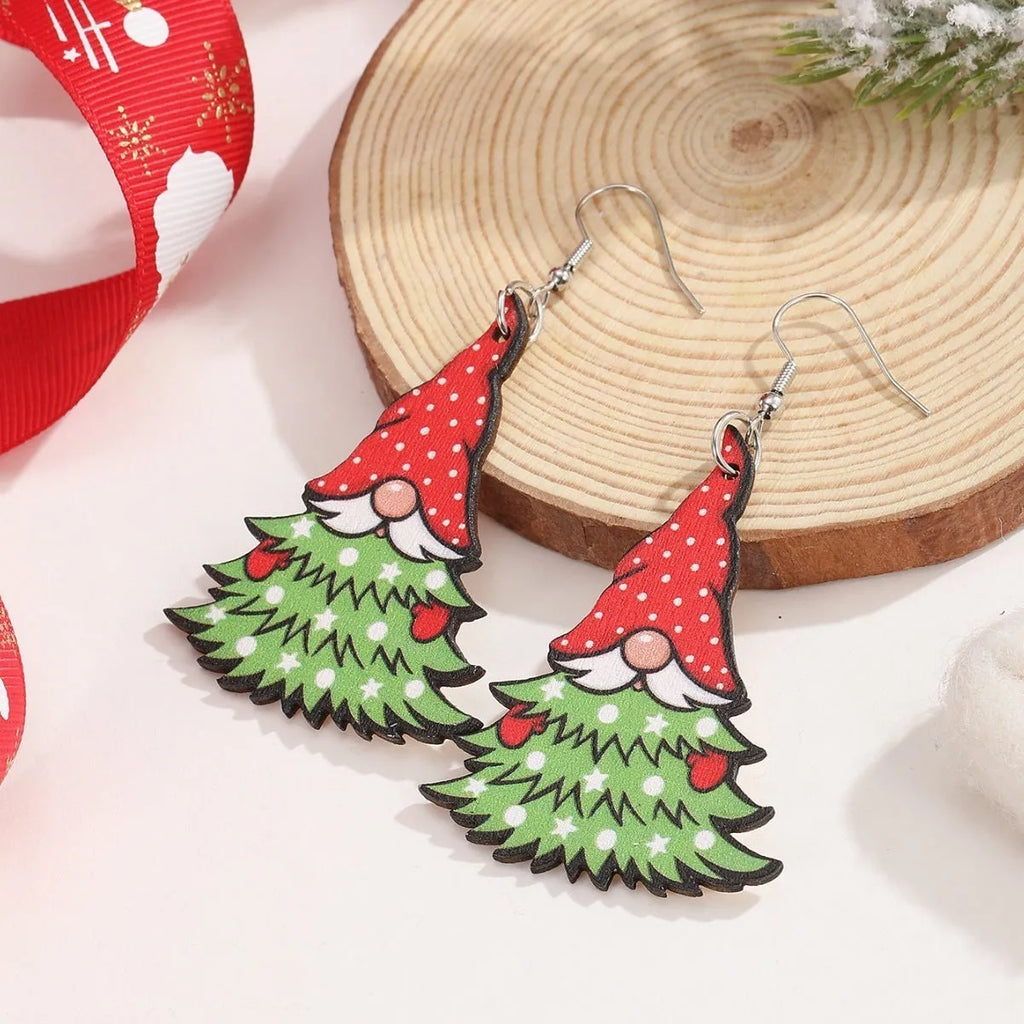 Wooden Christmas earrings with printed geometric designs featuring Santa Claus elements