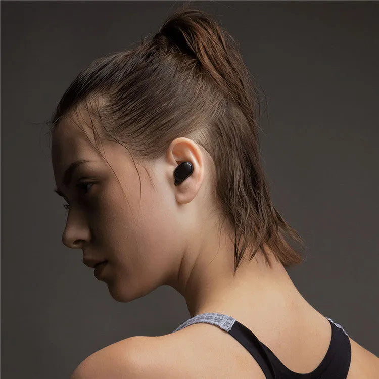 Black Redmi AirDots 2 true wireless earbuds and charging case on a white background.