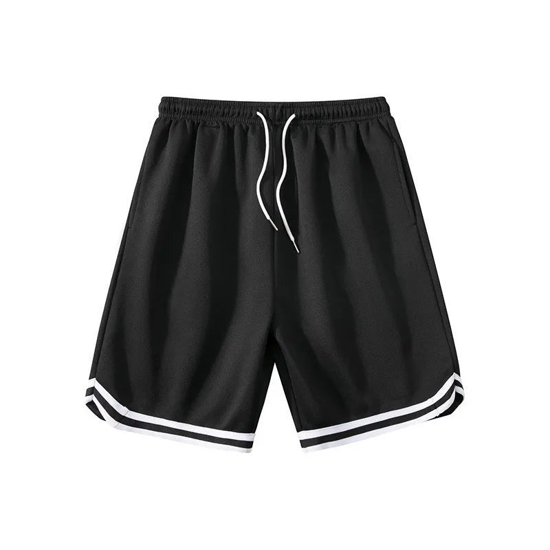 Man wearing loose-fit grey polyester sports shorts with an elasticated waistband.