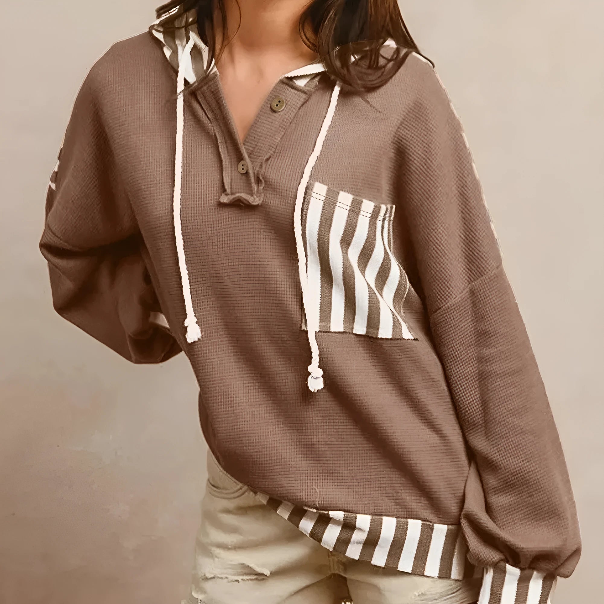 Straw yellow waffle texture hoodie with striped patchwork design, button neck, and drawstring hood.