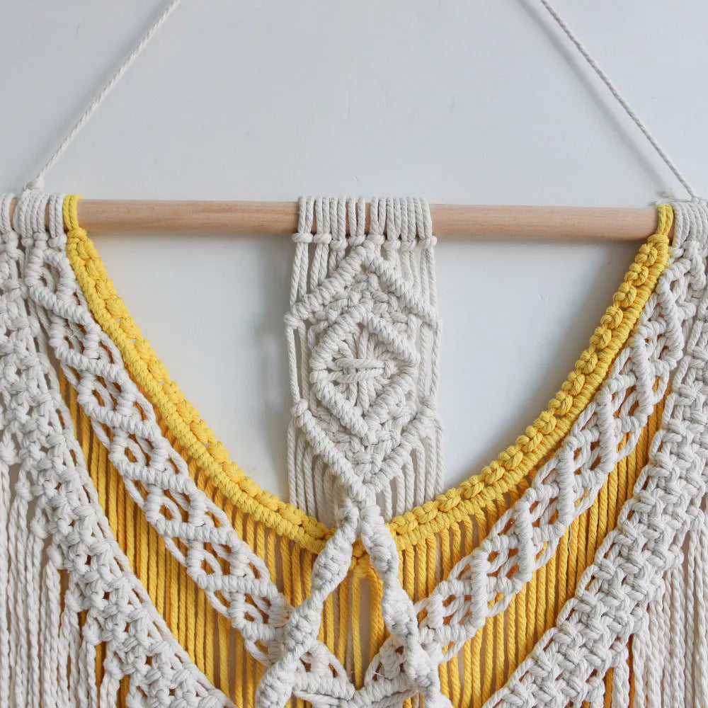 Hand-woven creamy white cotton tapestry with rectangular shape and textured surface