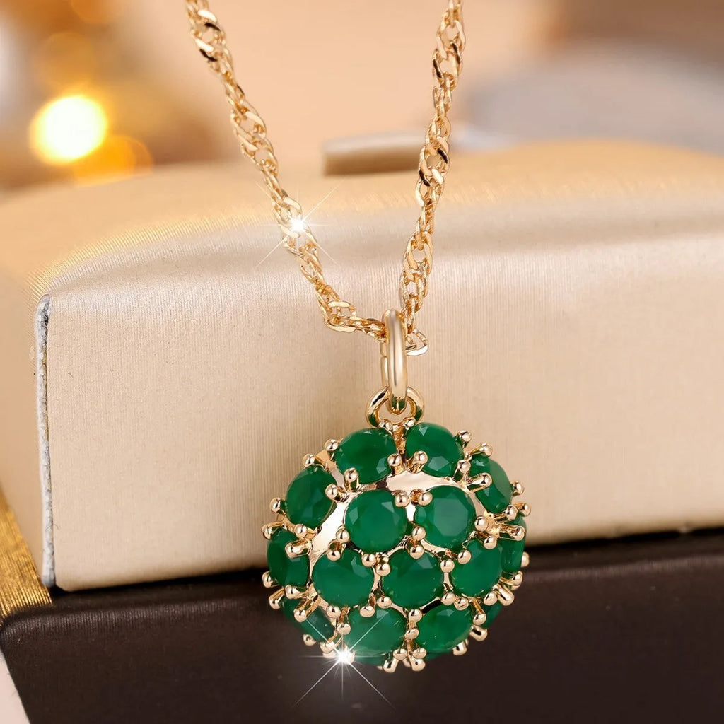 Round green jade pendant with diamond setting on champagne gold chain necklace