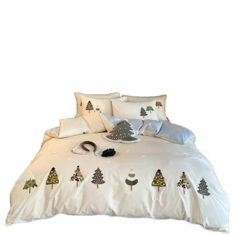 Cream Blue cotton duvet cover with embroidered Christmas tree and flower design, part of a four-piece bedding set.