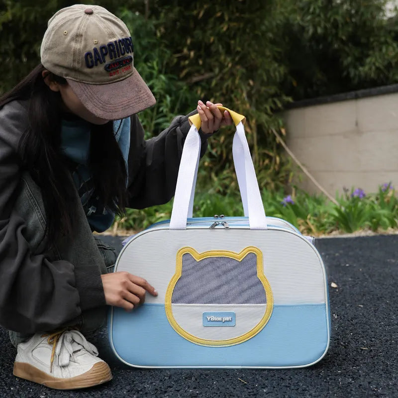Blue foldable cat backpack made from Oxford cloth, shown with ventilation and shoulder straps.