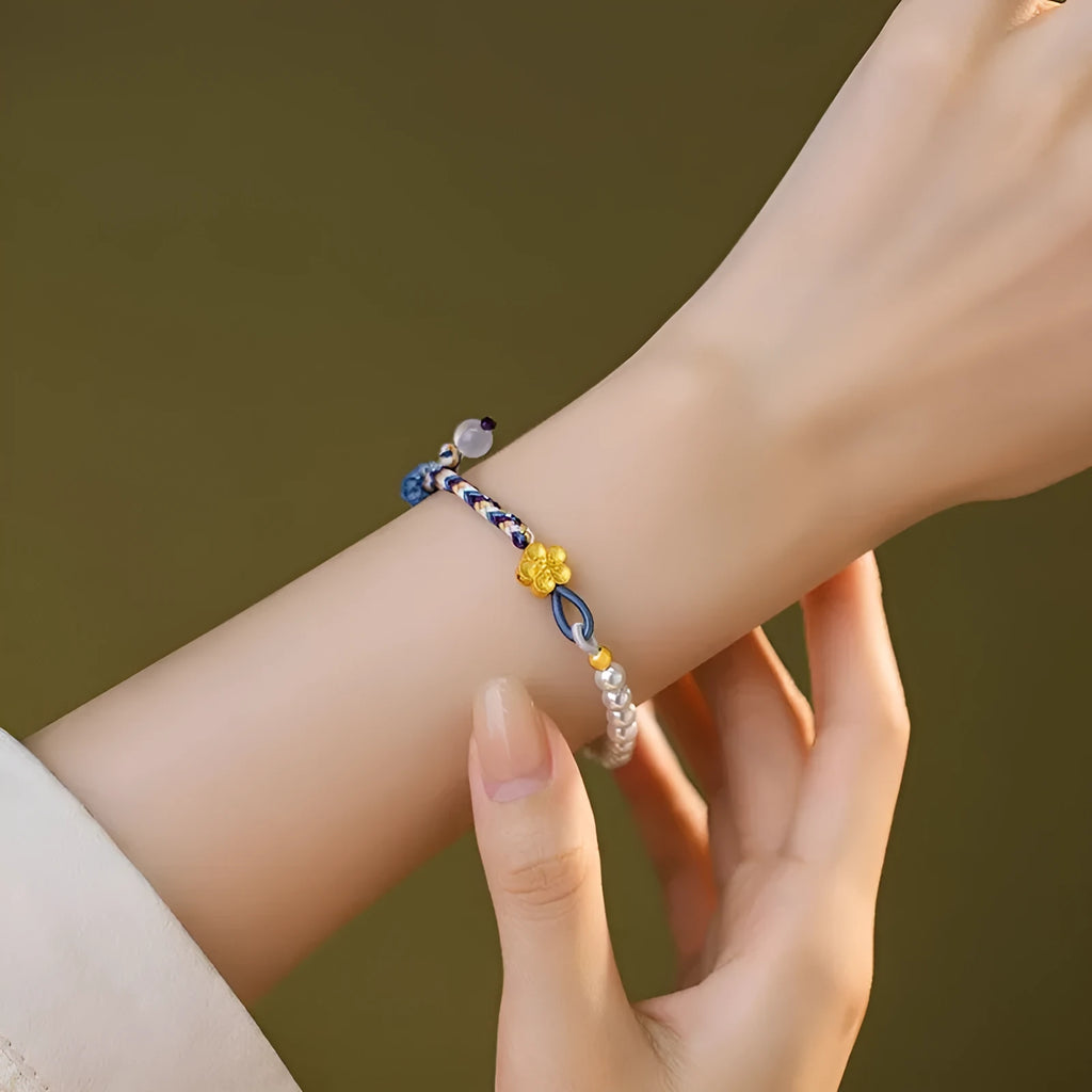 Peach coloured carrying strap bracelet with Chinese flower weaving pattern featuring sterling silver chalcedony and pearl decorative elements