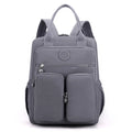 Women's waterproof nylon travel backpack showing internal organisation compartments and colour options