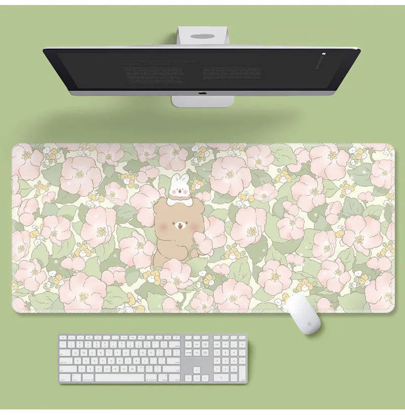 Floral pattern mouse pad on desk with keyboard, showing non-slip rubber base and colourful flower design
