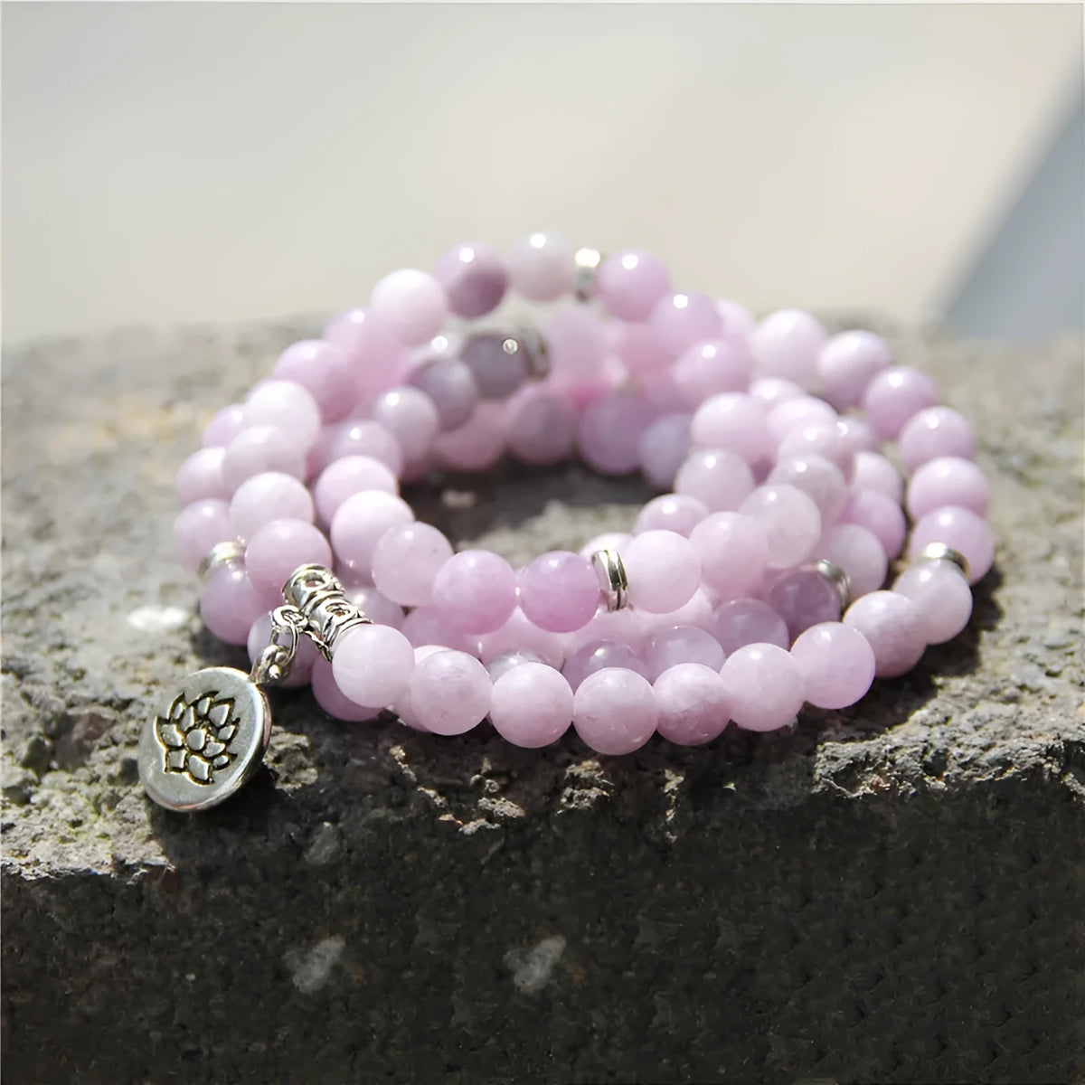 A women's vintage bracelet made of natural stone featuring a lotus geometry design.