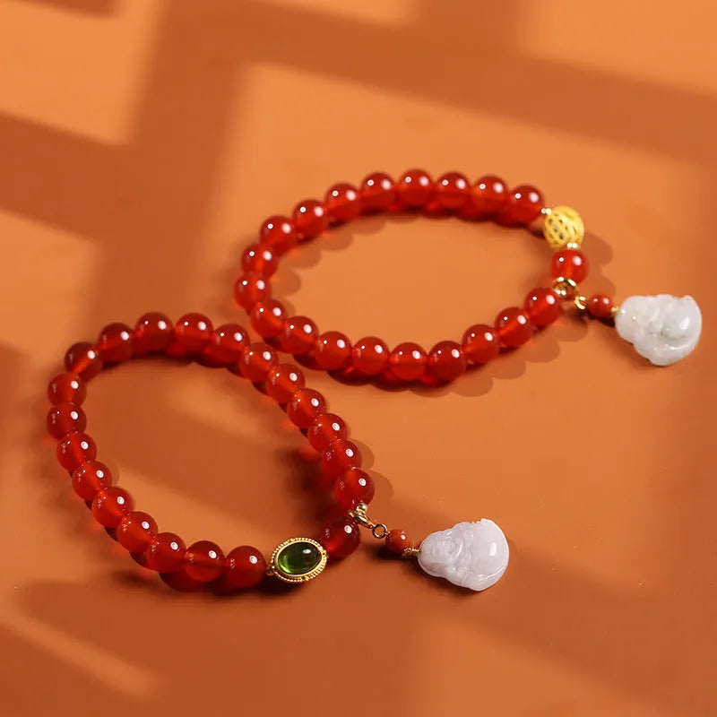 Handcrafted natural agate bracelet with red beads, amber geometric elements, and Maitreya Buddha charm