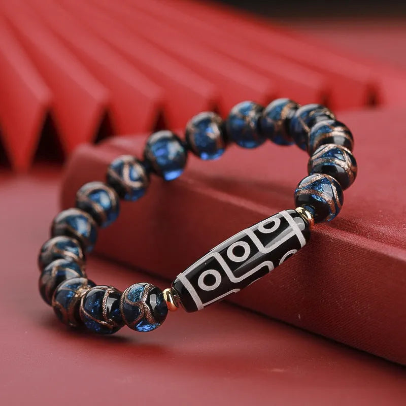 Chinese style lucky bracelet with colourful coloured glaze beads and auspicious patterns.