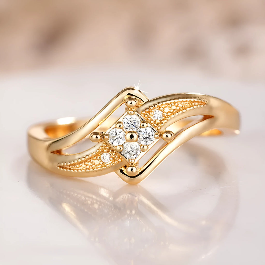 Copper diamond ring with geometric ornament and micro inlaid zircon in yellow gold colour