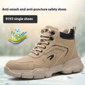 Men's brown lightweight labour protection shoes with steel toe cap on a workbench