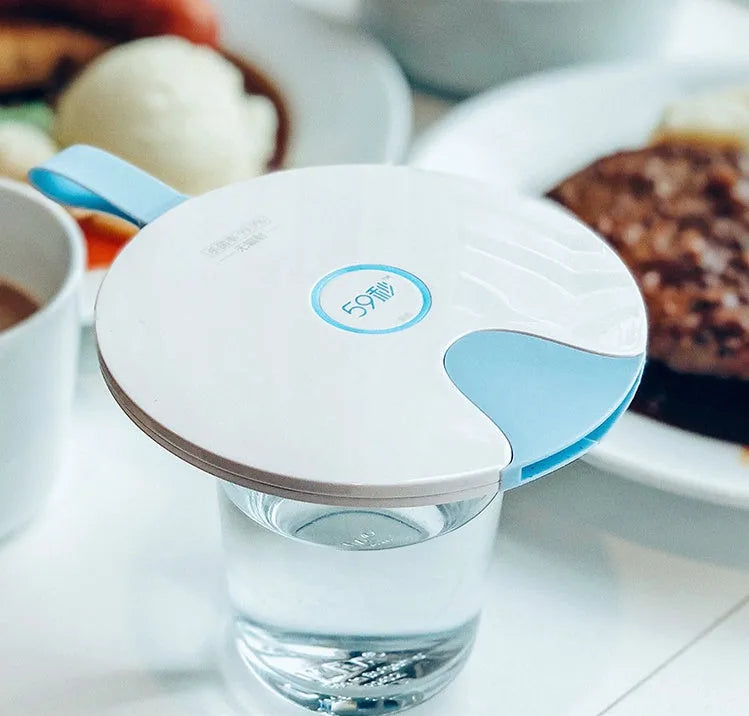 A slim, portable UV baby bottle steriliser in blue, showing its compact size and USB charging port.