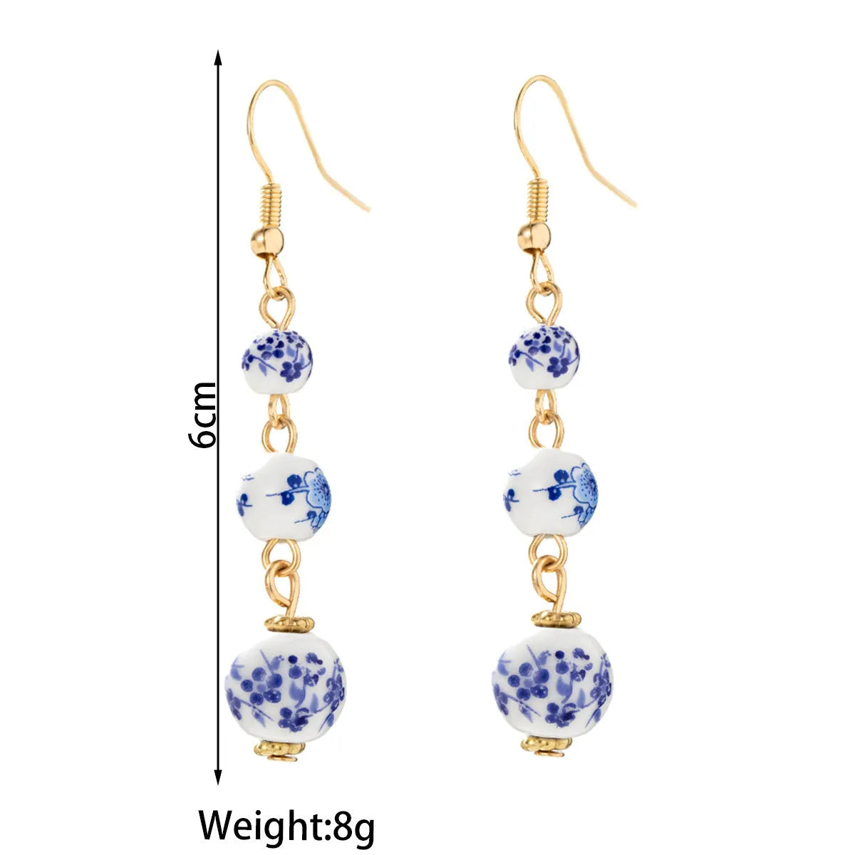 Long blue and white porcelain ceramic bead earrings with geometric Chinese-style design.
