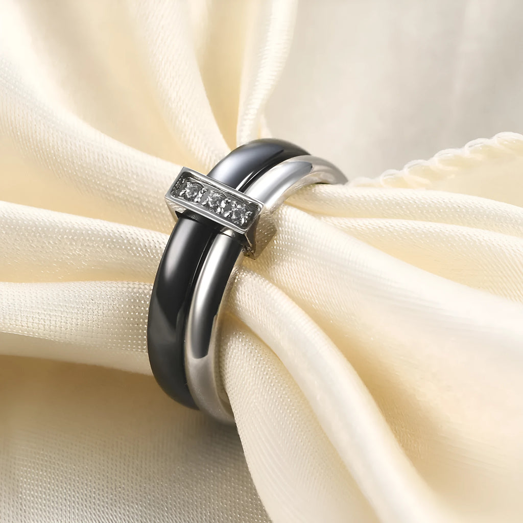 Geometric ceramic women's ring with glossy stitching and zirconium inlays in steel black finish