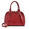 Large shiny PU leather crossbody bag in shell shape design showing black colour option