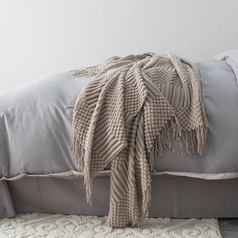 Small rectangular polyester nap blanket in dark grey, khaki, or light grey, shown flat with dimensions 127cm by 170cm.