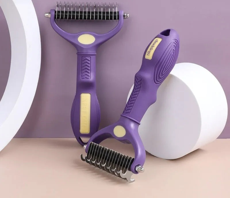 Purple double-sided plastic pet comb with ergonomic handle for removing tangles from cat and dog fur.