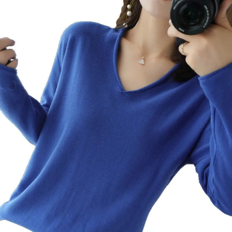 Women's V-neck long sleeve knit top in a macaron colour on a hanger.