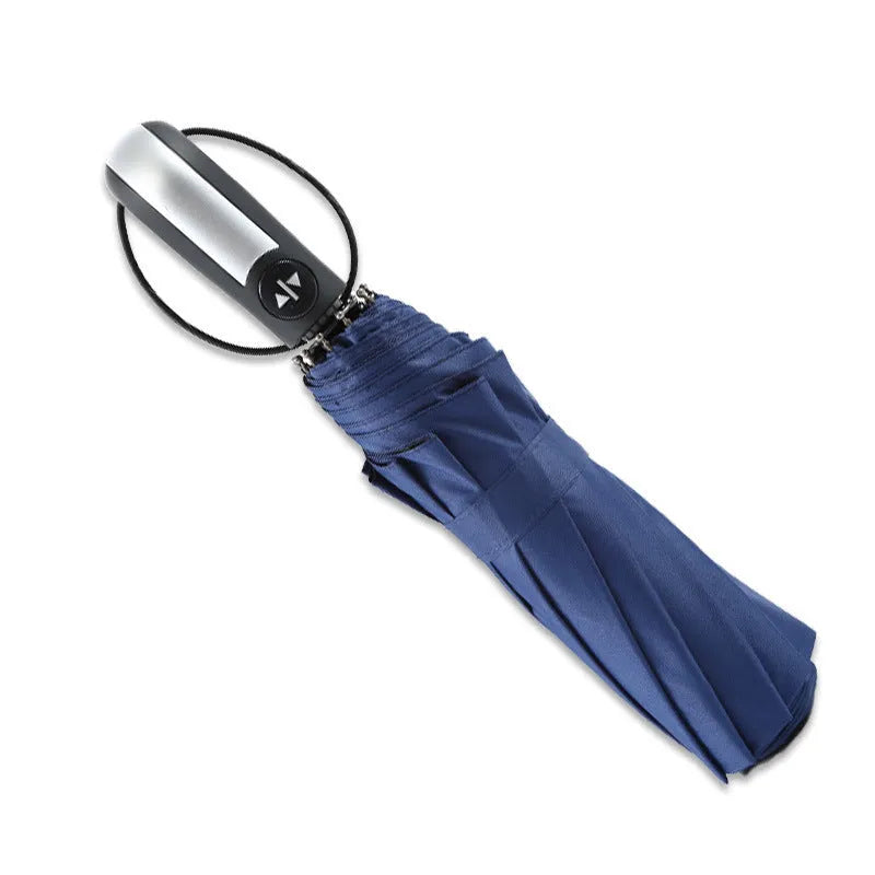 Triple-fold black automatic business umbrella with steel frame and rubber handle open.