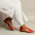 Red women's sandals with square buckle and herringbone toe holder design
