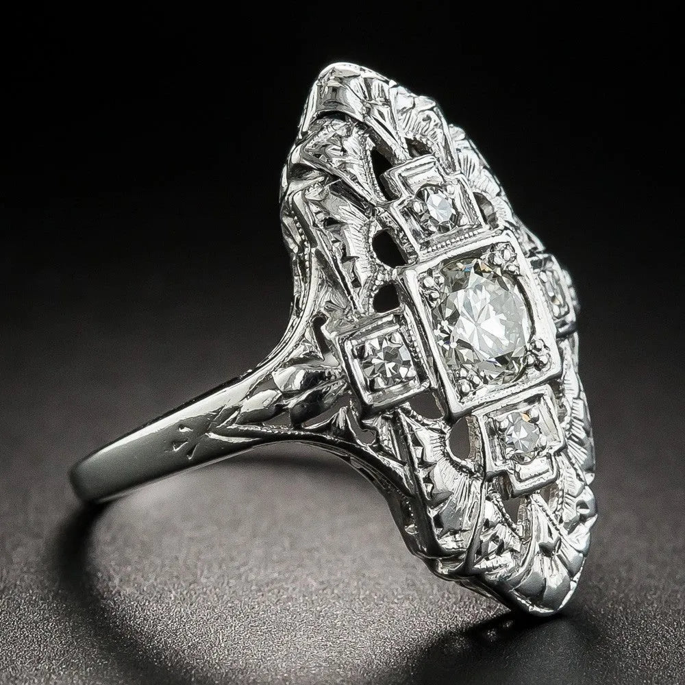 Hollow geometric silver-coloured ring with diamond-studded cubic zirconia stones, shown in profile view