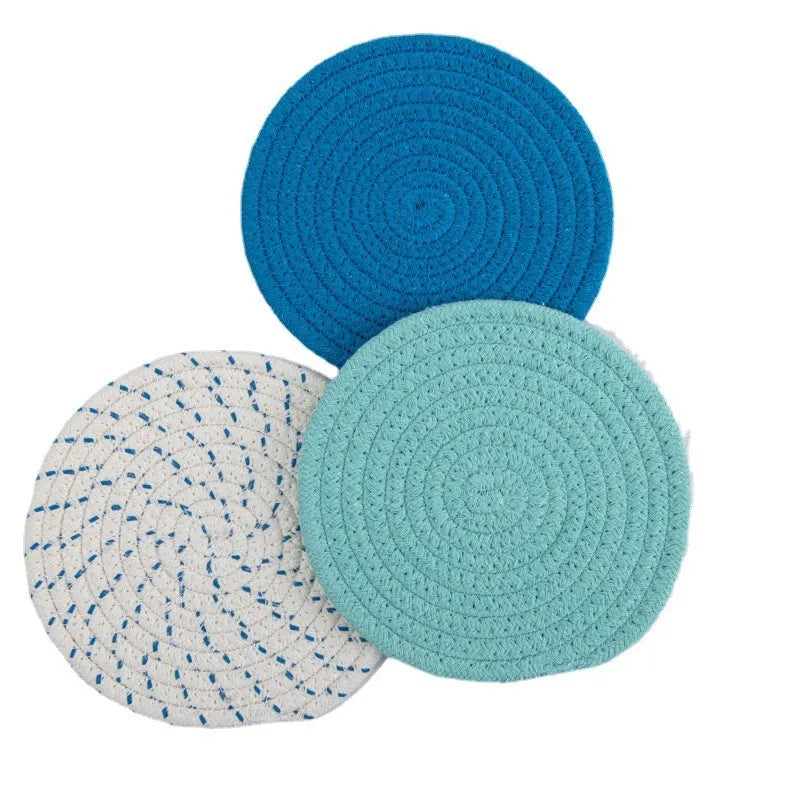 Three round 18cm cotton cord coasters in a set, shown in a blue colour option.